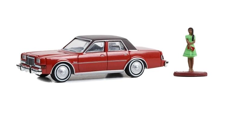 Greenlight - 1:64 The Hobby Shop Series 15 1983 Dodge Diplomat w/ Woman in Dress